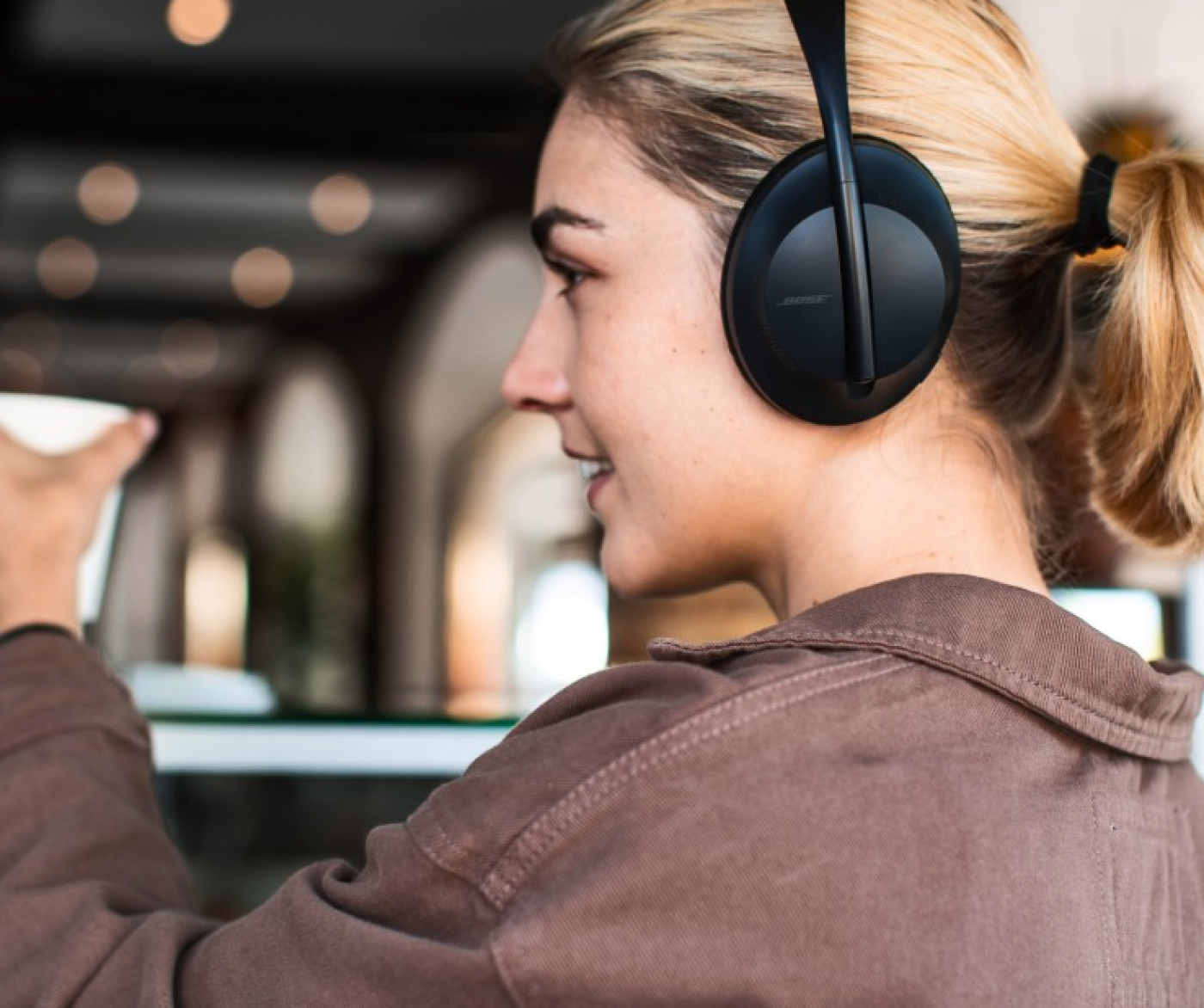 Woman wearing Bose headphones